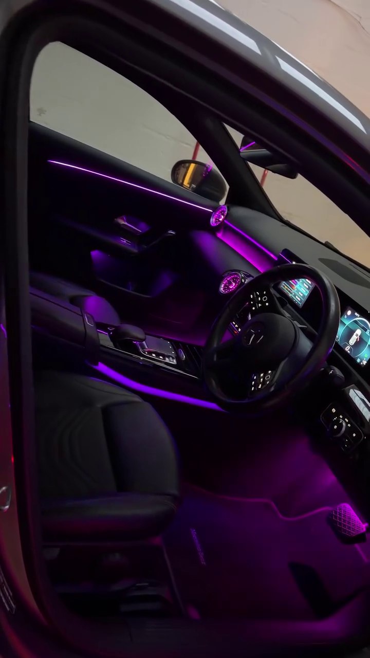 Purple ambient lighting in a Mercedes cabin