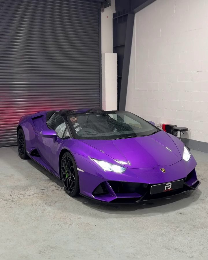 Purple Lamborghini parked inside the workshop